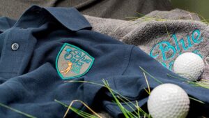 Polo piqué de algodón bordado con escudo de golf